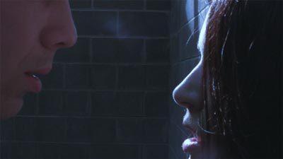 Close-up of a man and woman talking