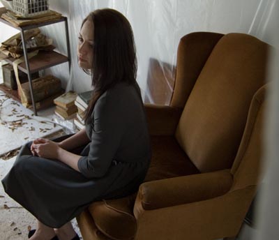 Woman sitting in a fancy chair