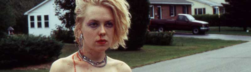 A suburban teenage girl with blood on her face