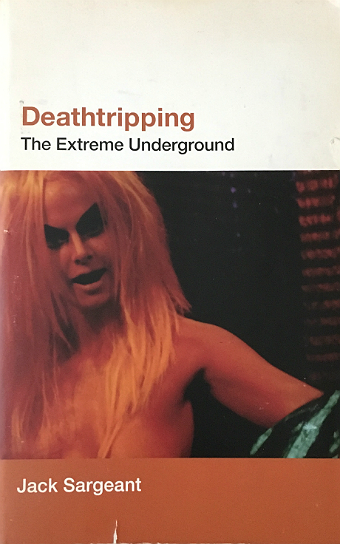 Deathtripping book cover with Kembra Pfahler in orange makeup and a fright wig