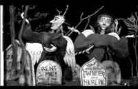 The Guilt Trip Puppets in a cemetery