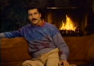 Baseball player Keith Hernandez sitting in front of a fireplace