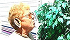 Older woman wearing an elf ear