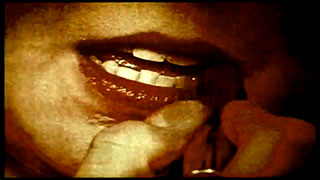 Parataxis Close-up of a woman putting on lipstick