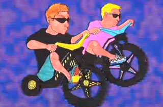 Video Challenge By Anamanaguchi Boys wearing sunglasses riding Big Wheels