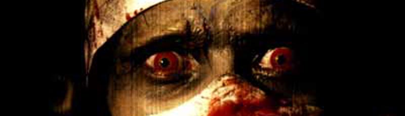 Extreme close up of a bloody doctor with red eyes