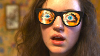 See You Next Tuesday Actress Eleanore Pienta wearing a pair of funny glasses