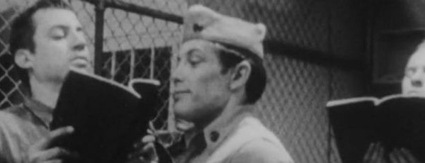 Military officer grills prisoners in the brig