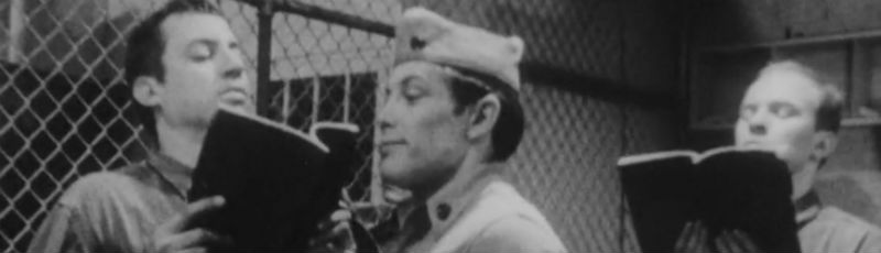 Military officer grills prisoners in the brig