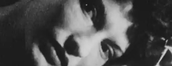 Maya Deren lies on the ground