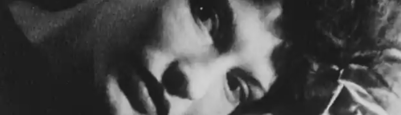 Maya Deren lies on the ground