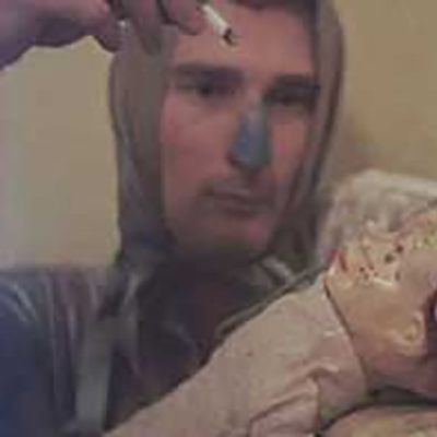Jack Smith burns a baby doll with a cigarette