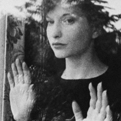Maya Deren stares out the window in her iconic film Meshes of the Afternoon