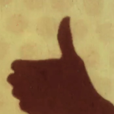 Silhouette of a hand giving the thumbs up from the animated film Swinging the Lambeth Walk by Len Lye