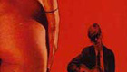 Man in a suit looking at a naked lady