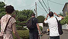 Band walking through a Japanese neighborhood