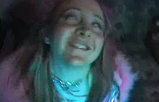 The Foreigner Woman wearing a pink feather boa dancing like a maniac