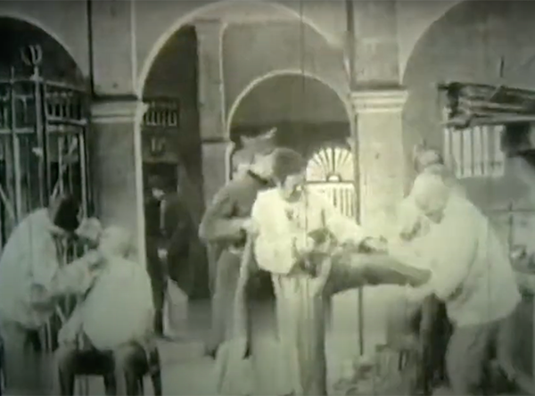 Prisoner getting a lock hammered onto his leg